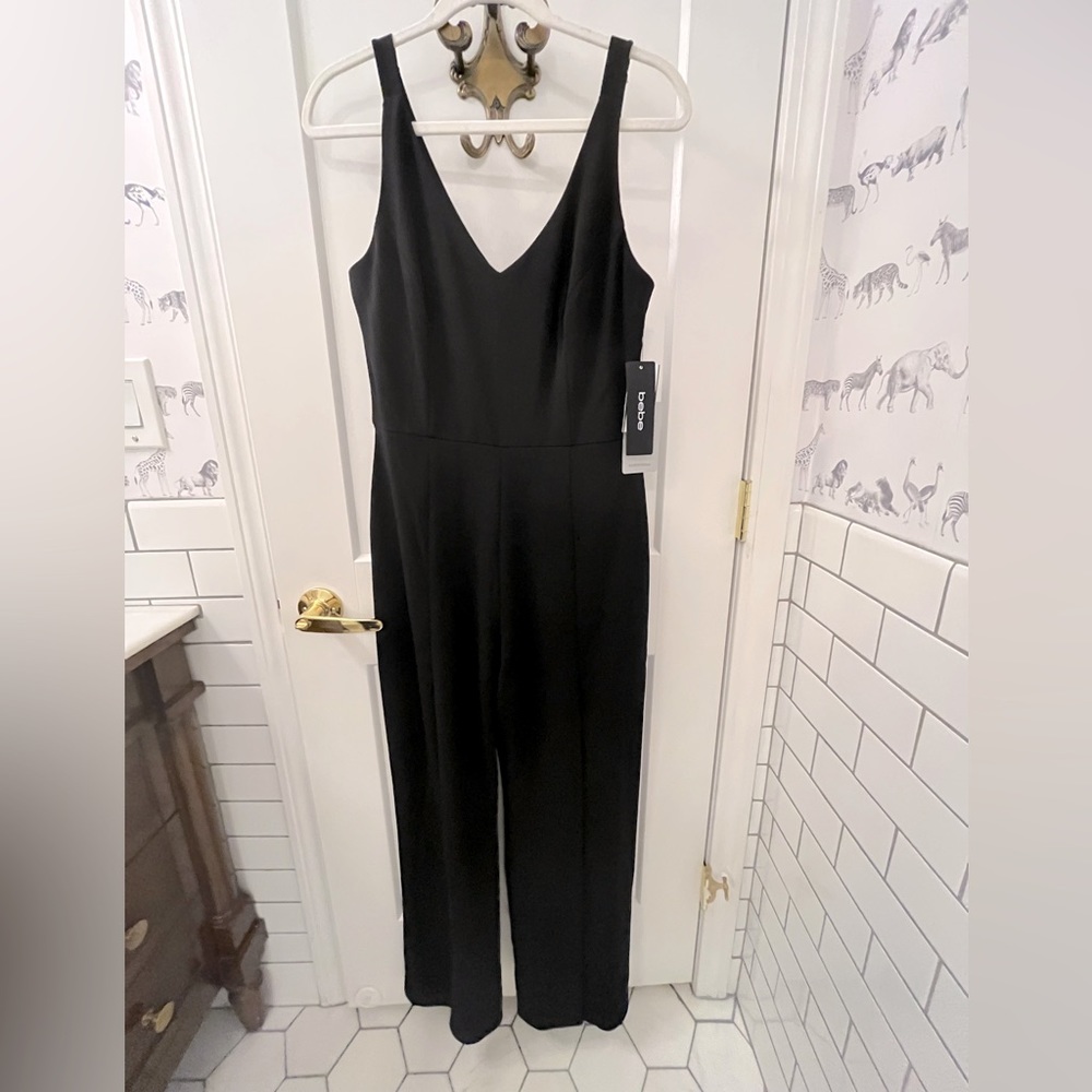 Bebe V neck open leg jumpsuit